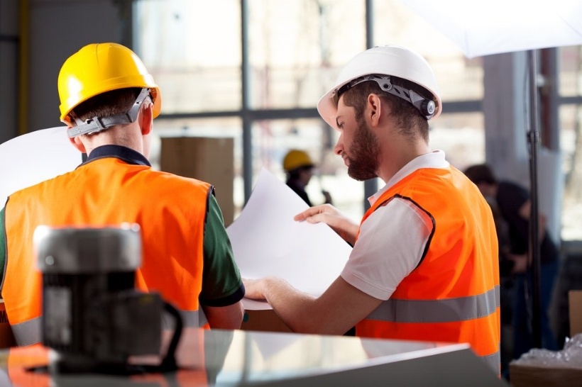 Male factory worker and supervisor are analyzing plans-460871-edited.jpeg
